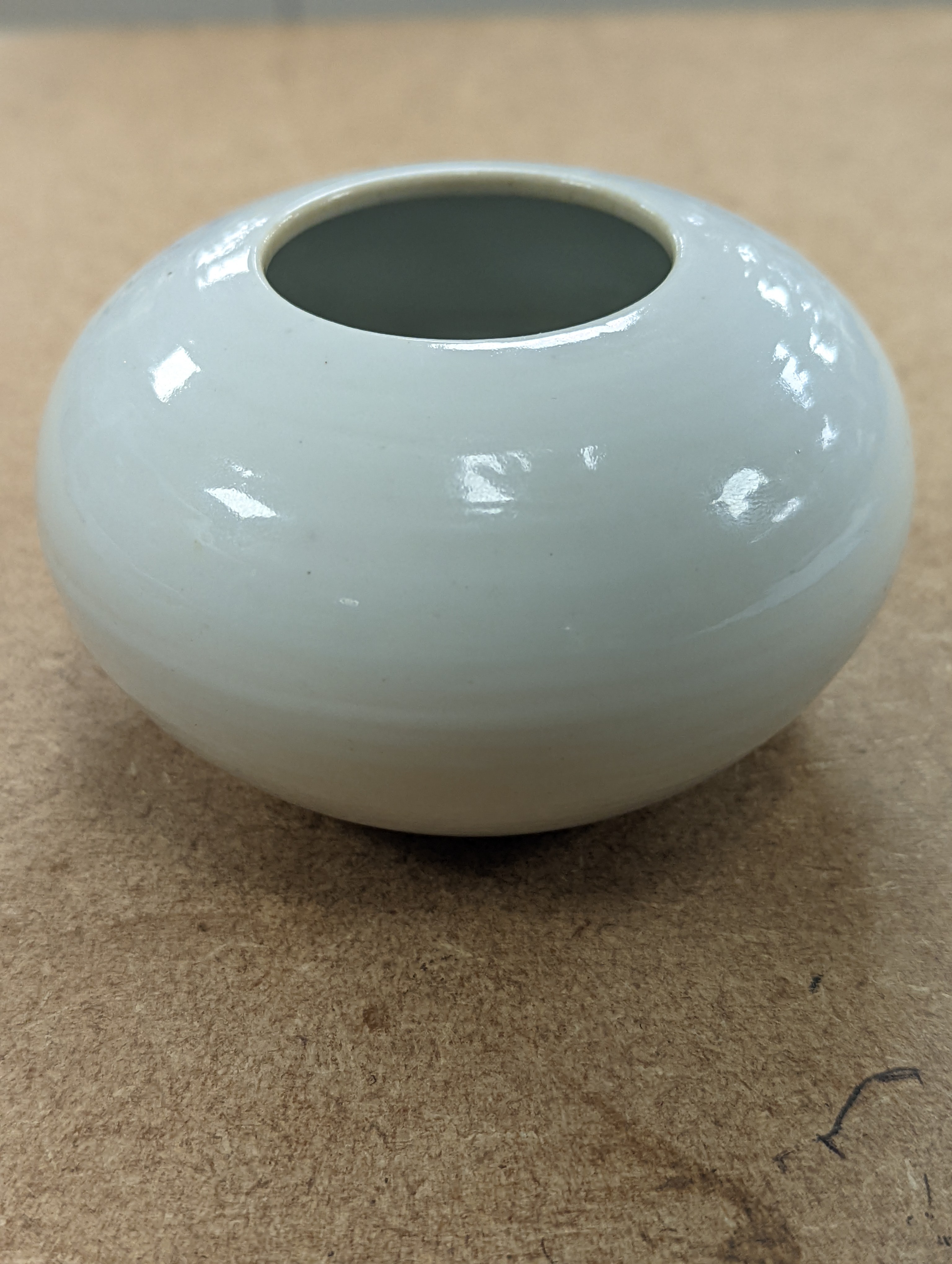 A Chinese white glazed water pot and a similar cup (2)